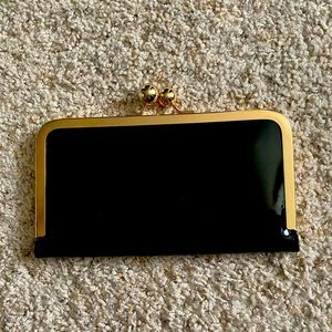 Patton leather black clutch with gold.